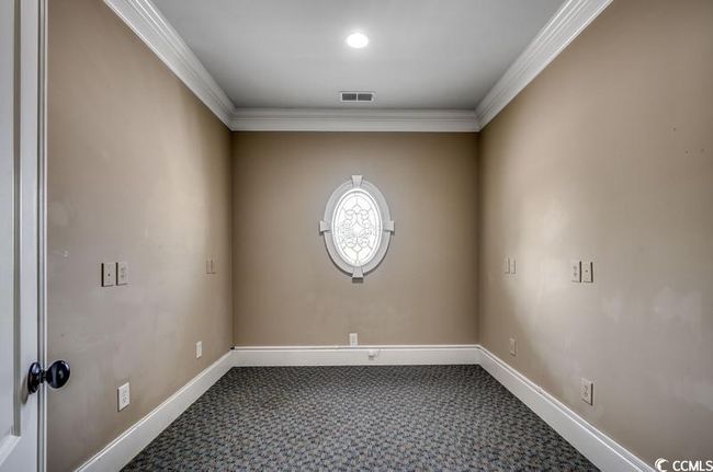 Carpeted spare room with ornamental molding and baseboards | Image 11