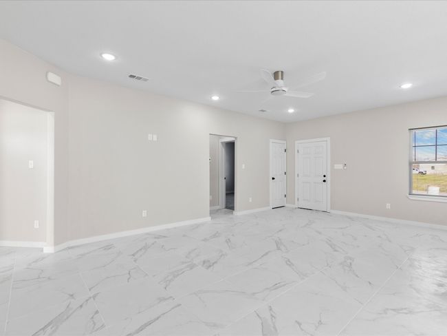 Spare room with ceiling fan, recessed lighting, visible vents, and baseboards | Image 8