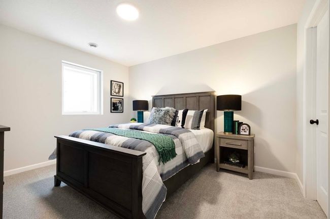 Lower level bedroom includes large walk-in closet. | Image 24