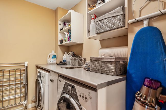 Laundry area featuring washing machine and dryer | Image 20