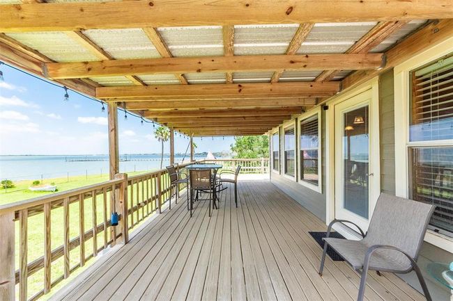 Imagine watching the rain come in from this front porch view | Image 45