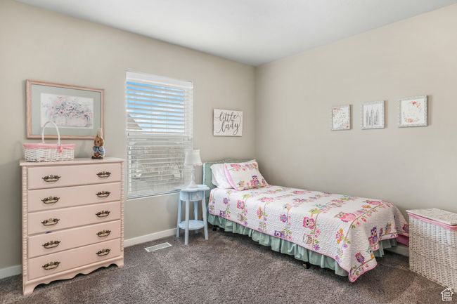 Bedroom with carpet, baseboards, and visible vents | Image 12