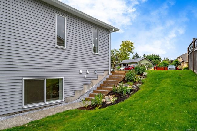 Side yard and walkway to downstairs entrance | Image 58