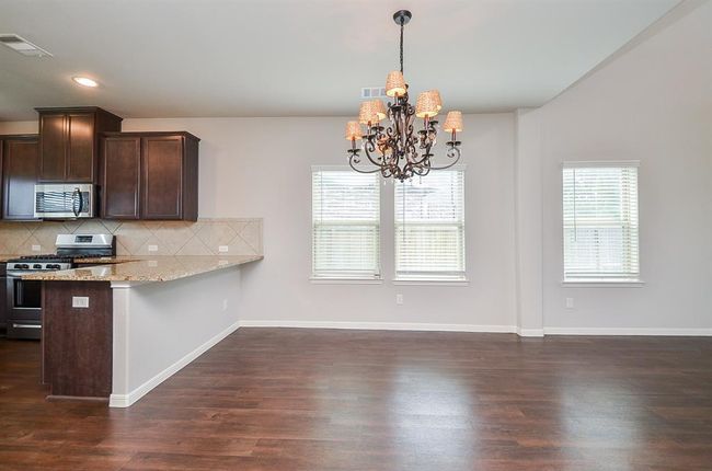 Picture your lovely dining pieces under this spectacular chandelier! | Image 6