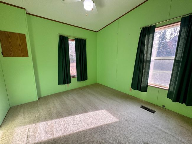 Bedroom #2 has 2 windows and a spacious closet | Image 12