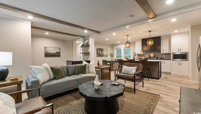 Living room with beam ceiling, recessed lighting, and light wood-style flooring | Image 7
