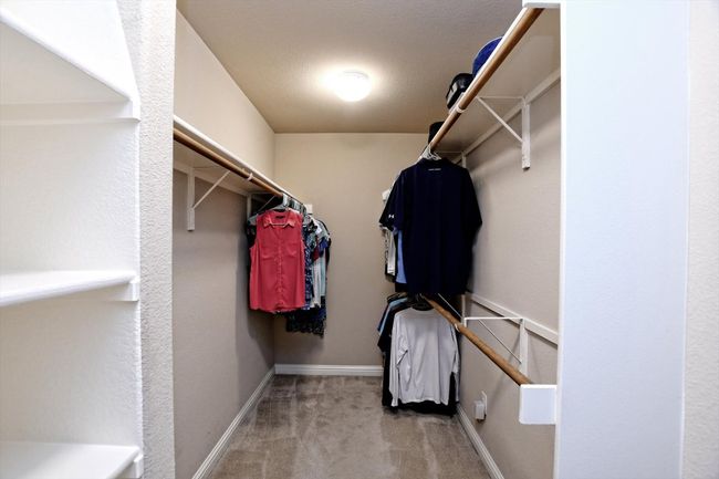 Spacious closet with carpet flooring | Image 18