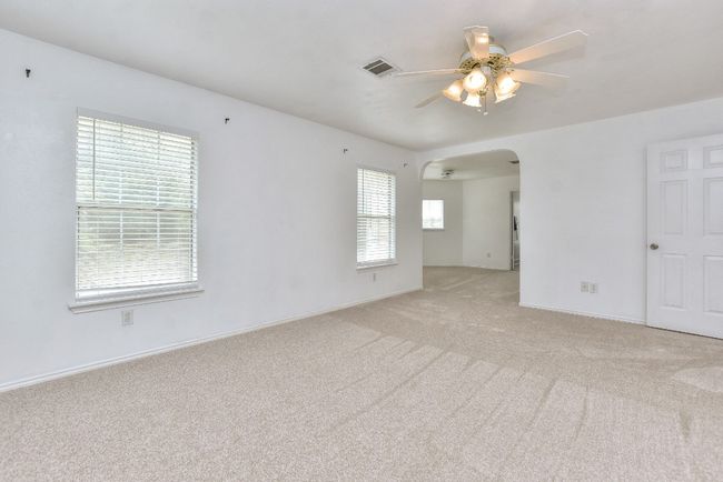 The primary suite has fresh carpet and here you can see that additional sitting room that could be used for a home office, hobby room, reading room, home gym, nursury....whatever your heart desires! | Image 24