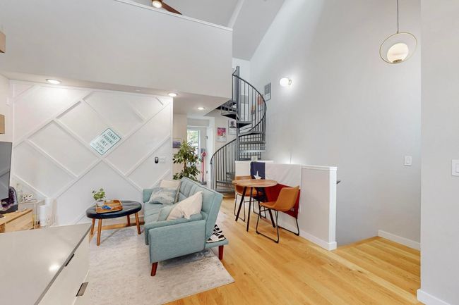 Sitting room featuring stairway, wood finished floors, and baseboards | Image 16