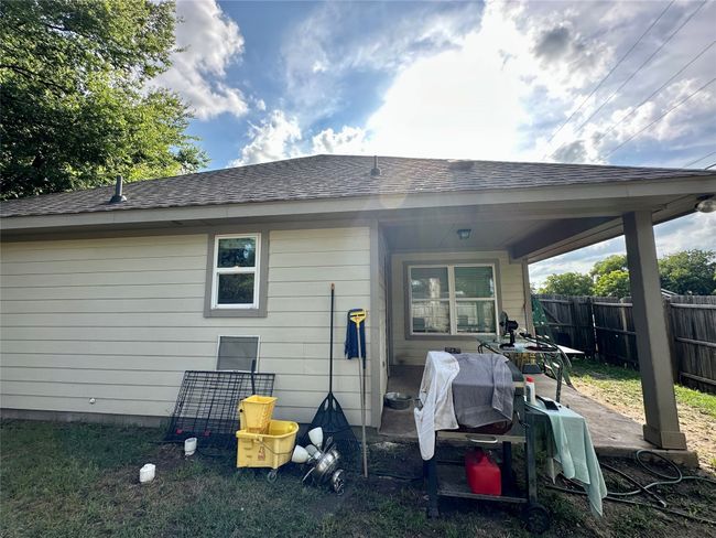 Rear view of property featuring roof with shingles and a patio area | Image 39