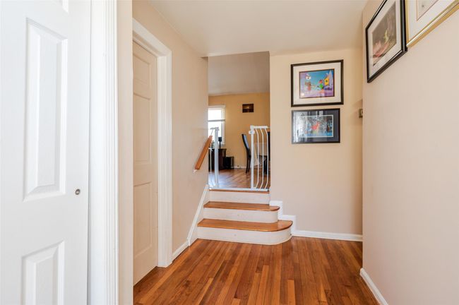 Stairway with wood-type flooring and baseboards | Image 7