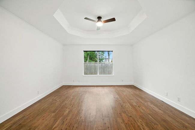 The smart floor plan includes a private primary suite tucked away at the back of the home. | Image 14