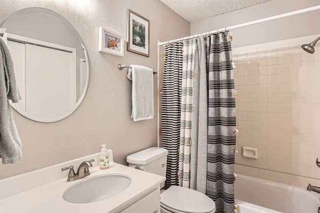 Newer tile surround and newer countertops. | Image 19