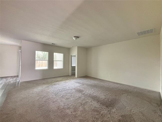 Carpeted empty room with baseboards | Image 7