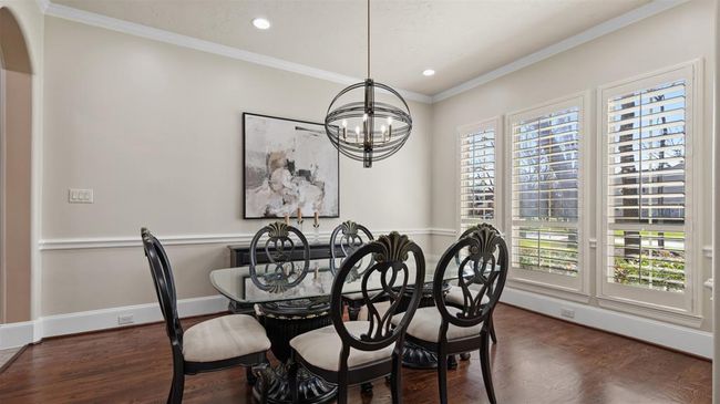 The formal dining room is ready for welcome your family while enjoying the manicured grounds. | Image 13