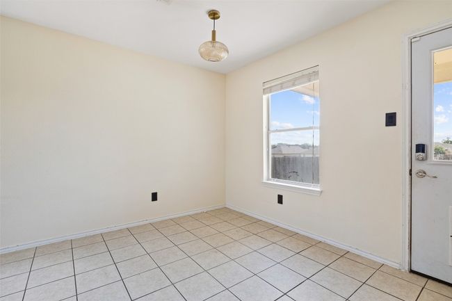Spare room with plenty of natural light, light tile patterned flooring, and baseboards | Image 16