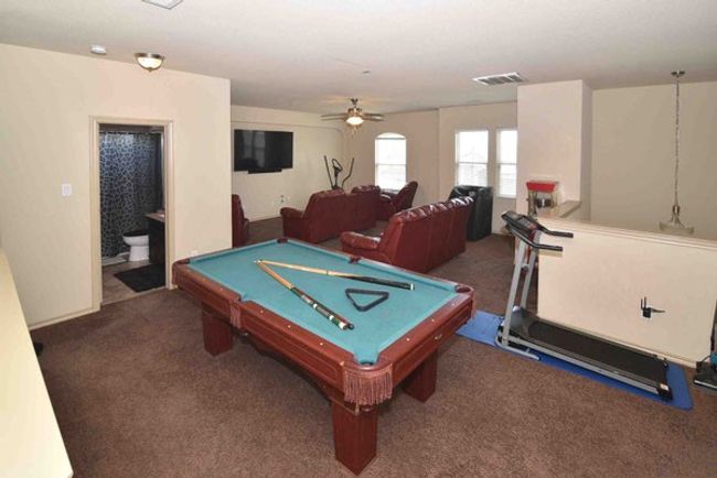 Playroom with carpet floors, ceiling fan, and billiards | Image 22