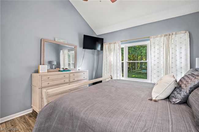 Bedroom with high vaulted ceiling, dark hardwood / wood-style floors, and ceiling fan | Image 21