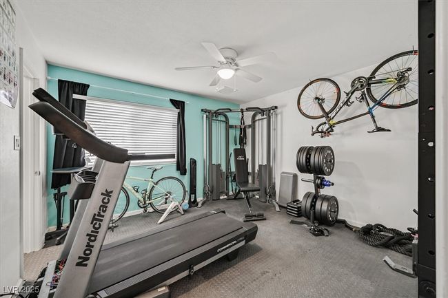 Exercise area with a ceiling fan and baseboards | Image 20