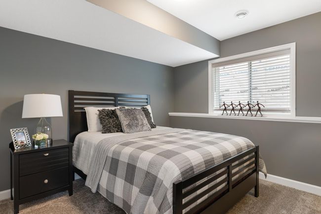 (Photo of decorated model, actual home's finishes will vary) A fourth bedroom is included at both the standard finished basement and the optional finished basement. | Image 21