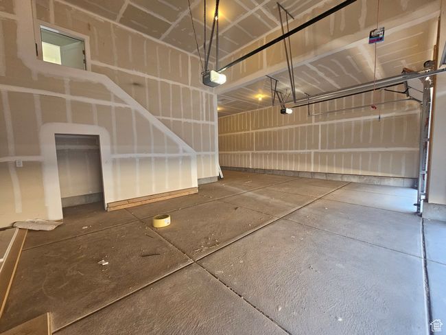 Garage featuring a garage door opener | Image 30