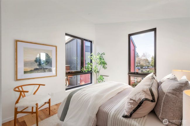 The third bedroom is bathed in natural light, creating a bright and welcoming space. | Image 20