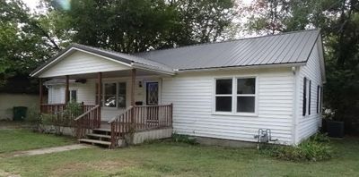 with a front lawn, covered porch, and central AC | Image 3