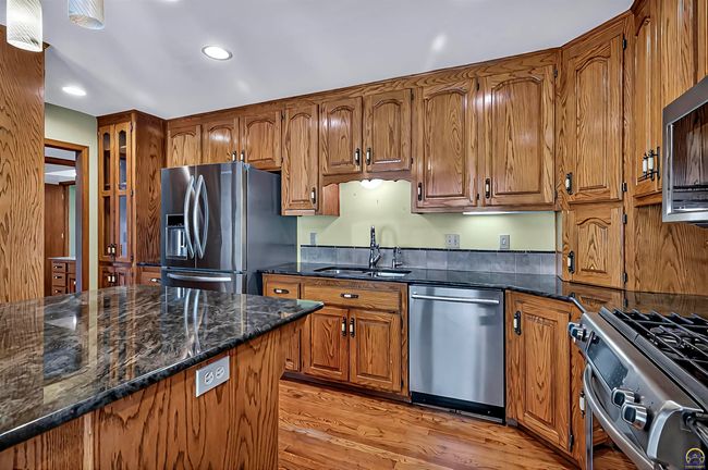 3835 Sw Wood Valley Dr, House other with 5 bedrooms, 3 bathrooms and null parking in Topeka KS | Image 4