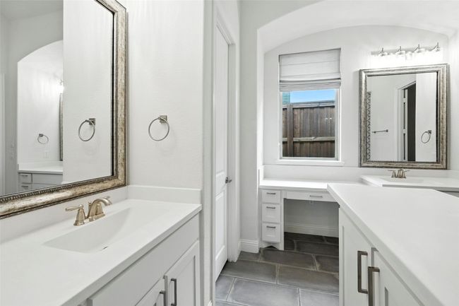 Bathroom with two vanities and tile patterned flooring | Image 25