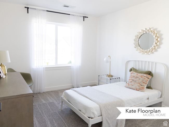 Bedroom with carpet floors, baseboards, visible vents, and multiple windows | Image 10