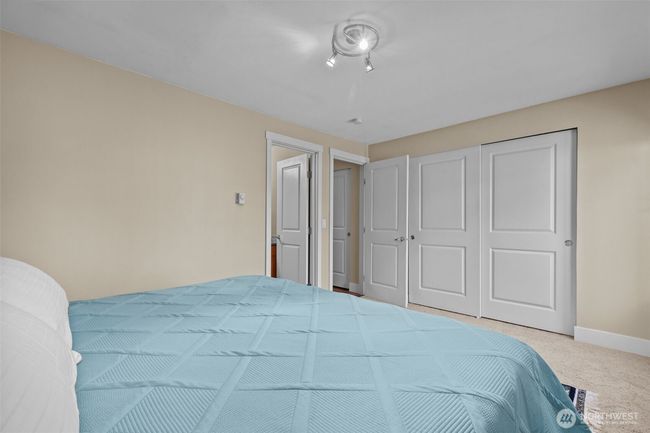 There is no shortage of closet space in the Primary! I like that this one is a 3-door closet w/sliding panels. | Image 19