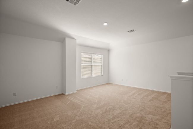 Empty room with recessed lighting, light carpet, visible vents, and baseboards | Image 20