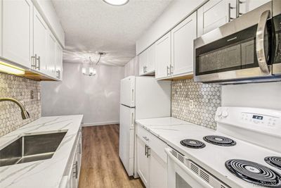 Updated kitchen with beautiful quartz counter tops! | Image 1