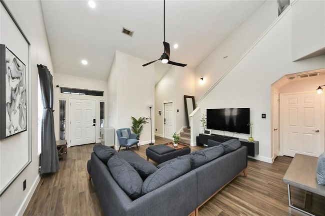 Vaulted ceiling and modern lighting. | Image 6