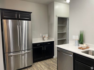 Kitchen with stainless steel appliances and prep area with new quartz countertop. | Image 3