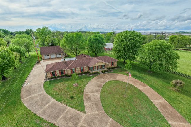 grand entrance with landscaping | Image 4