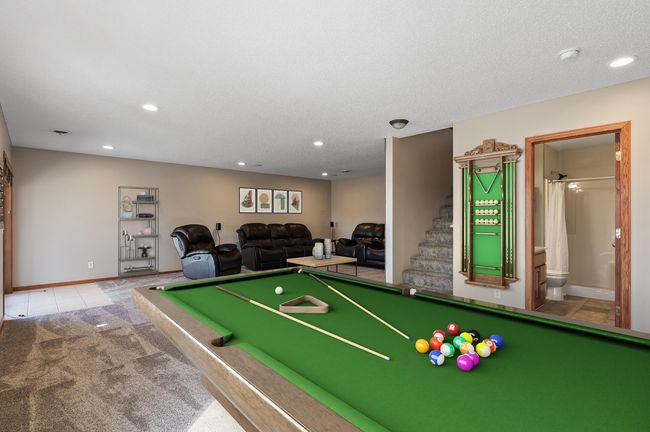 Pool table virtually staged to show potential in the basement | Image 33