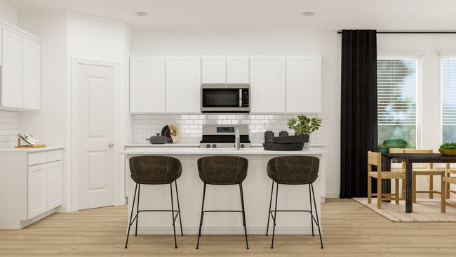 Kitchen with light wood-type flooring, white cabinetry, and stainless steel appliances | Image 4