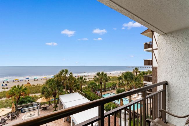 Balcony featuring view of water and beach | Image 13
