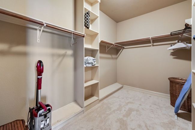 The massive walk in closet provides more than enough space to stash away all your wardrobe without sacrificing space in the bedroom. | Image 20