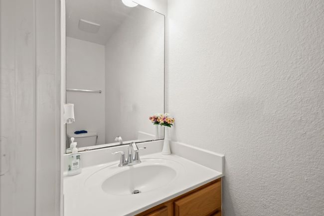 Bathroom with vanity and a textured wall | Image 21