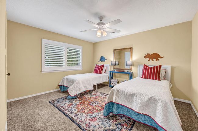 One of three secondary bedrooms upstairs. | Image 33