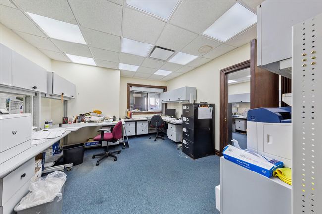 Carpeted home office with a paneled ceiling | Image 41