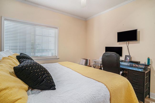 Bedroom featuring ornamental molding, a desk, and a ceiling fan | Image 16