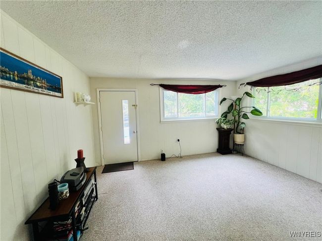 bonus room/family room with door to oatio | Image 18