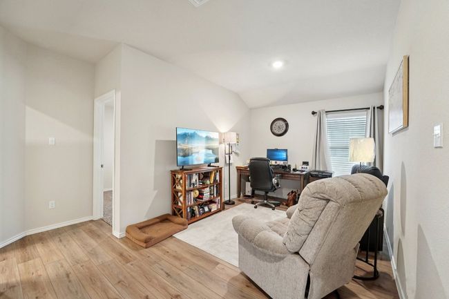 Office featuring light wood-style flooring and vaulted ceiling | Image 15