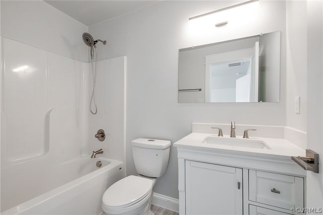 Full bathroom featuring shower combination, toilet, and vanity | Image 32