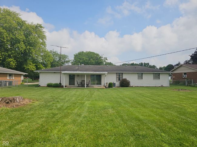 rear view of house featuring a patio and brick siding | Image 5