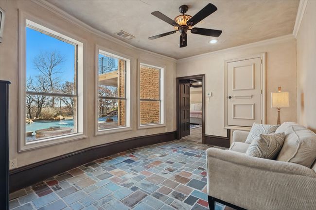 The sitting room is adjacent to the bottom floor bedroom and could be part of a mother in law apartment. | Image 32