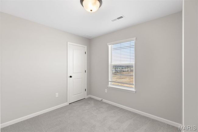 Empty room with baseboards and light colored carpet | Image 18